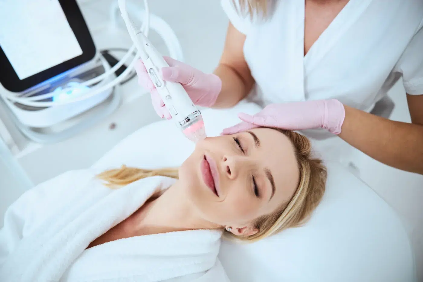 Smiling relaxed woman enjoying the cosmetic procedure Smiling relaxed woman enjoying the cosmetic procedure