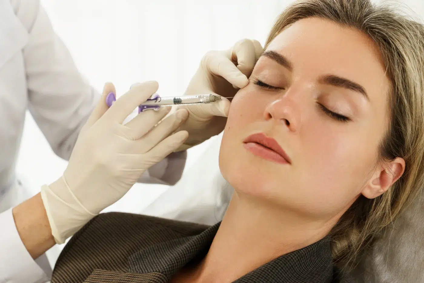 dermal filler Woman during facial filler injections in aesthetic medical clinic dermal filler Woman during facial filler injections in aesthetic medical clinic