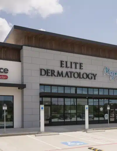 Angled exterior shot of the Elite Dermatology medical clinic storefront and parking area. Angled exterior shot of the Elite Dermatology medical clinic storefront and parking area.
