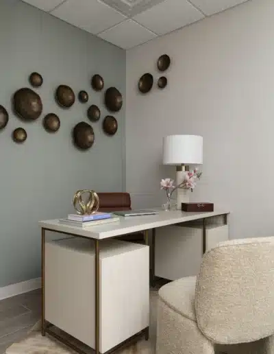 Consultation desk and cream bouclé chair in a physician office at Elite Dermatology. Consultation desk and cream bouclé chair in a physician office at Elite Dermatology.