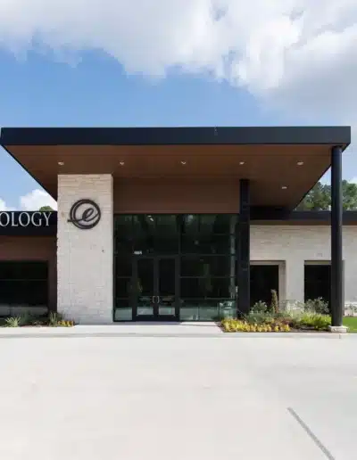 Front entrance of Elite Dermatology Kingwood with stone pillar and glass doors. Front entrance of Elite Dermatology Kingwood with stone pillar and glass doors.