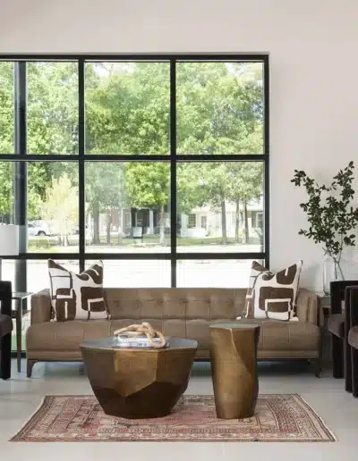Sunlit clinic waiting room at Elite Dermatology Kingwood with leather couch, velvet armchairs, and floor-to-ceiling windows. Sunlit clinic waiting room at Elite Dermatology Kingwood with leather couch, velvet armchairs, and floor-to-ceiling windows.