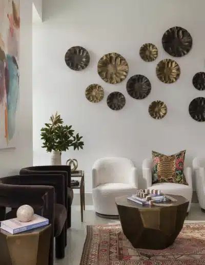 Modern clinic waiting room seating area with boucle chairs, velvet armchairs, and metallic coffee table. Modern clinic waiting room seating area with boucle chairs, velvet armchairs, and metallic coffee table.